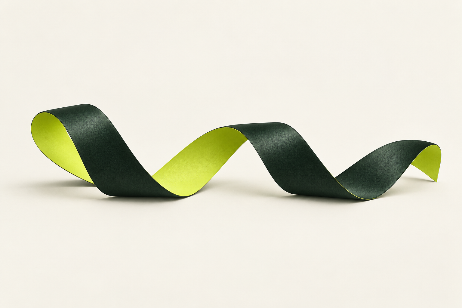 An ink green ribbon folds across an ivory ground, revealing chartreuse inner faces.